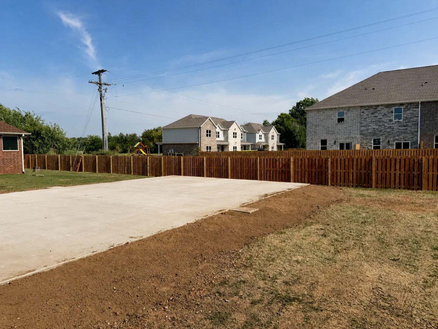 Long stained wood fence line
