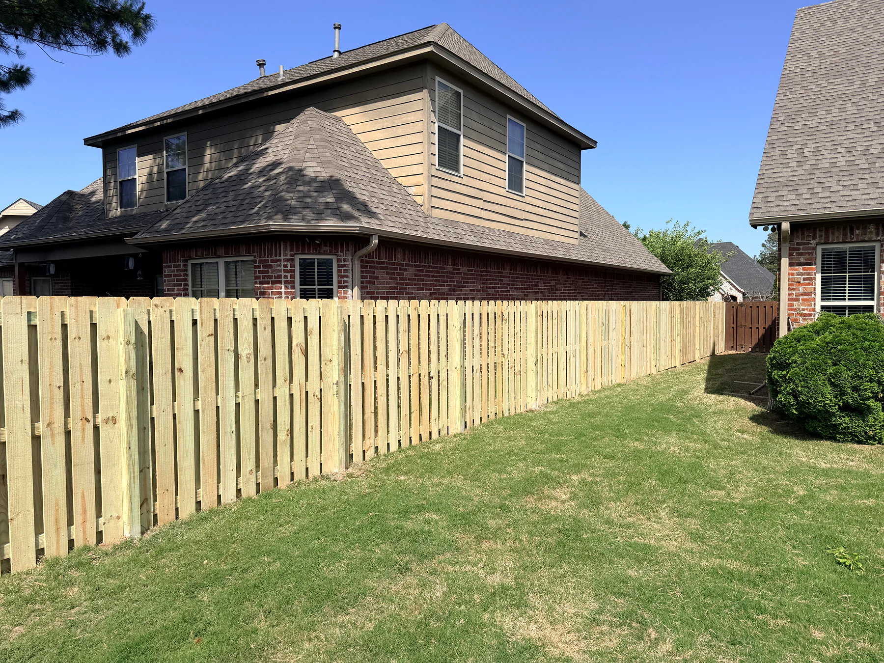 Wood picket fence along a residential property line